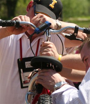 Participants assembling a child's bike