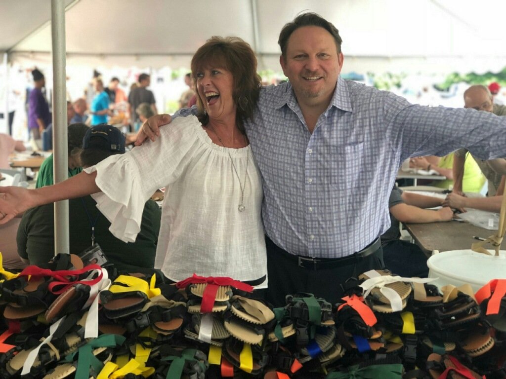 Two colleagues laughing together during a Building Teams corporate team building event
