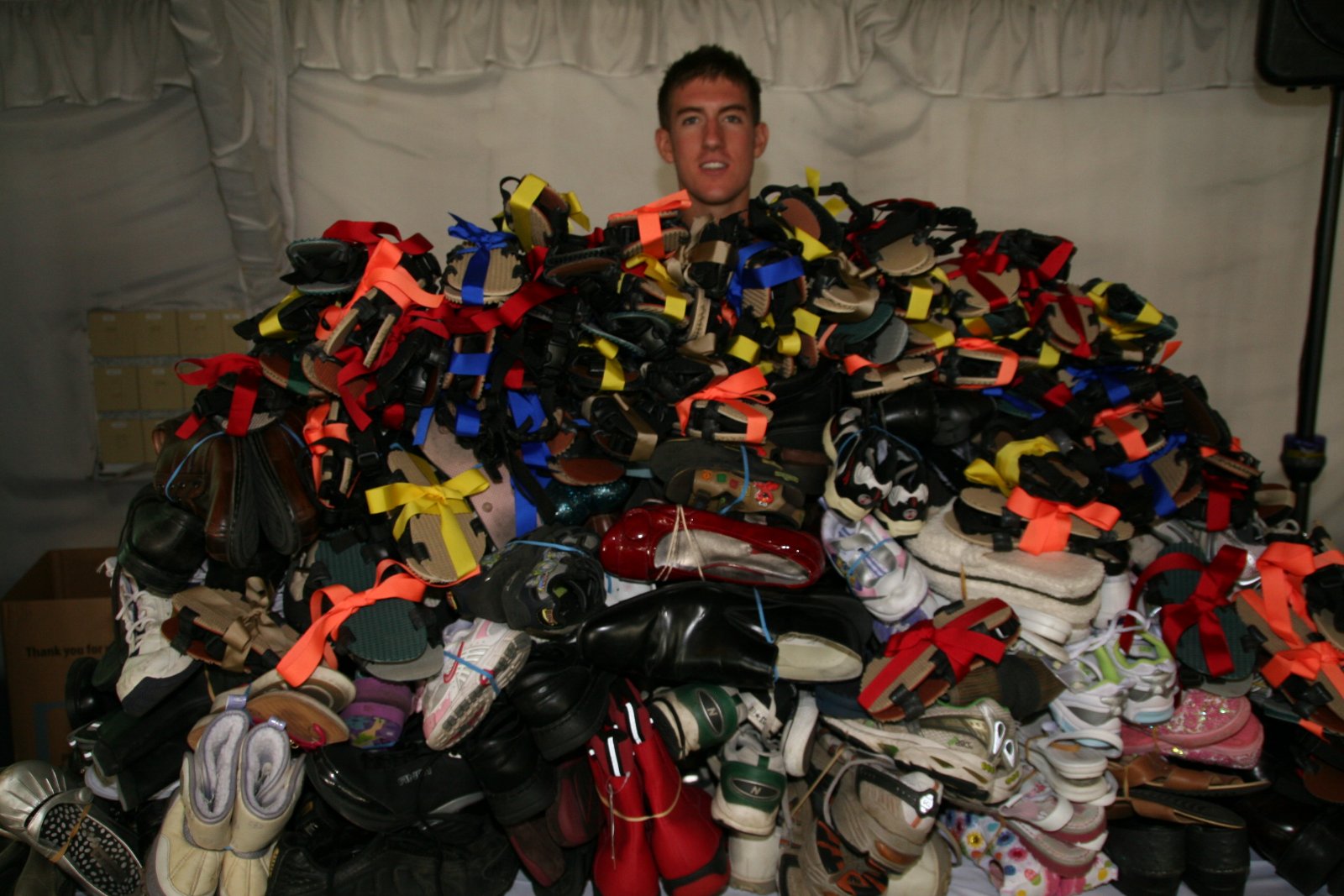 Shoes assembled for donation at a Boulder event
